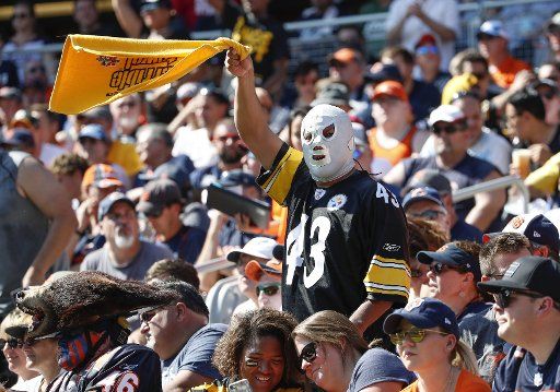The Pittsburgh Steelers fan cheers on his team during the first of a NFL game against the Chicago Bears half at Soldier Field in Chicago on September 24, 2017. Photo by Kamil Krzaczynski\/
