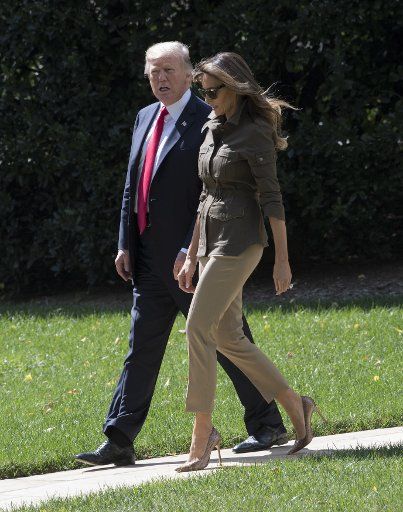 U.S. President Donald and first lady Melanie walk from the Oval Office to Marine One on the South Lawn to depart the White House in Washington, DC on September 15, 2017. The president will be in New York next week for the UN General Assembly. ...