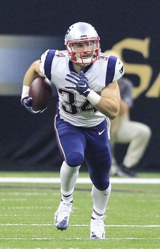 New England Patriots running back Rex Burkhead (34) goes 18 yards against the New Orleans Saints in the first quarter at the Mercedes-Benz Superdome in New Orleans September 17, 2016. Photo by AJ Sisco\/