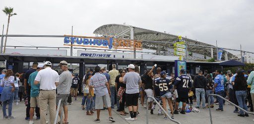 Fans enter the stadium to watch the Los Angeles Chargers play the Miami Dolphins at StuHub Center in Carson, California on September 17, 2017. Photo by Lori Shepler\/