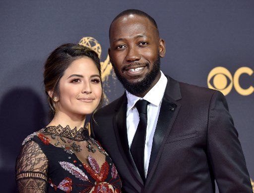 Actor Lamorne Morris (R) and Erin Lim arrive for the 69th annual Primetime Emmy Awards at Microsoft Theater in Los Angeles on September 17, 2017. Photo by Christine Chew\/