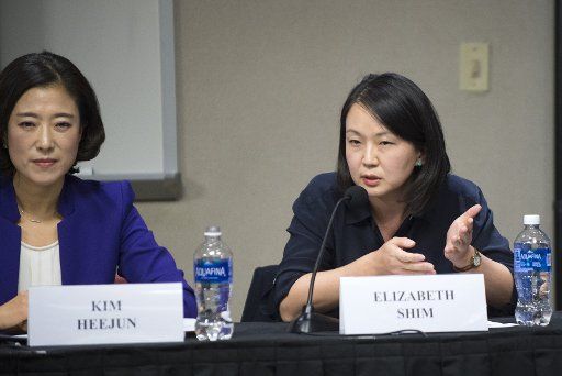 UPI Chief Asia Writer Elizabeth Shim makes a comment during a discussion regarding the challenges of reporting news in North and South Korea, during event at the John Hopkins School of Advanced International Studies in Washington, DC on November 15, ...