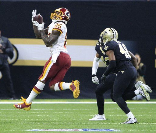Washington Redskins tight end Vernon Davis (85) grabs a 26 yards pass from Kirk Cousins in front of New Orleans Saints defenders at the Mercedes-Benz Superdome in New Orleans November 19, 2017. Photo by AJ Sisco\/