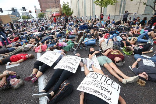 Protesters lay on the ground during a "die-in" during a peaceful protest outside of St. Louis Metropolitan Police Headquarters in St. Louis on September 17, 2017. A non-guilty verdict of a former white St. Louis policeman in the 2011 shooting of a black man in St. Louis has resulted in two nights of peaceful marching eventually turning violent. Jason Stockley was acquitted of first degree murder charges in the fatal shooting of Anthony Lamar Smith on Dec. 11, 2011 following a high-speed chase. Police have made nearly 50 arrests while a score of businesses have suffered broken windows. Photo by Bill Greenblatt\/UPI..