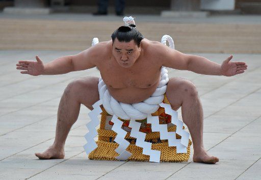 Mongolian grand sumo champion Yokozuna Harumafuji performs Shiranui-style entering ceremony for the New Year\