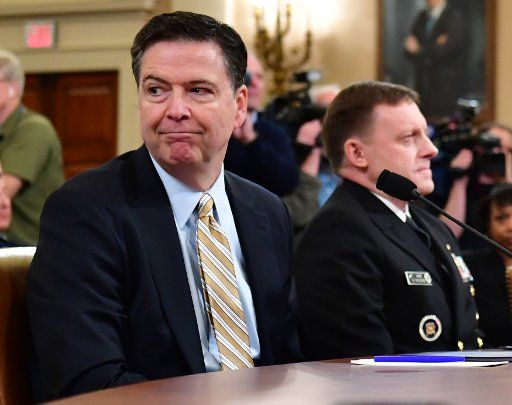 James Comey, Director of the Federal Bureau of Investigation (L), and Mike Rogers, Director of the National Security Agency, wait to testify on Russia\