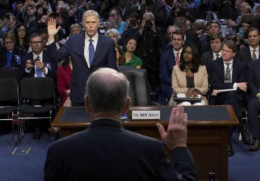 Supreme Court Justice nominee Neil Gorsuch is sworn-in during his confirmation hearing before the Senate Judiciary Committee on Capitol Hill in Washington, D.C. on March 20, 2017. President Donald Trump nominated Gorsuch to fill the position left after the February, 2016 death of Justice Antonin Scalia. Pool photo by Steven Crowley\/