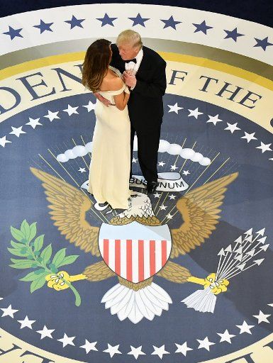 President Donald Trump dances with First Lady Melania Trump while attending the Commander-in-Chief\