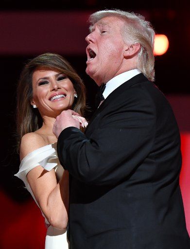 President Donald Trump sings along to "My Way" during a dance with First Lady Melania Trump while attending the Freedom Ball on January 20, 2017, in Washington, D.C. Trump attended a series of balls to cap off his Inauguration. Photo by Kevin Dietsch\/