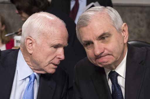 Senate Armed Services Chairman John McCain (R-AZ) (L) talks to ranking member Sen. Jack Reed (D-RI) before a hearing on Foreign Cyber Threats to the United States on Capitol Hill in Washington, D.C. on January 5, 2017. Photo by Kevin Dietsch\/