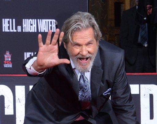 Actor Jeff Bridges participates in a hand and footprint ceremony immortalizing him in the forecourt of TCL Chinese Theatre (formerly Grauman\