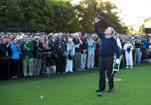 Golf legend Jack Nicklaus raises his hat to the air in honor of the late Arnold Palmer during the ceremonial first tee shot on the first day of the 2017 Masters Tournament at Augusta National Golf Club in Augusta, Georgia, on April 6, 2017. Palmer passed away in September of last year at the age of 87. Photo by Kevin Dietsch\/