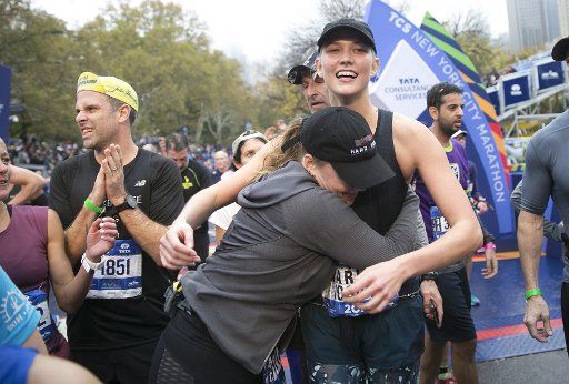 Super Model Karlie Kloss reacts when she crosses the finish line completing the NYRR TCS New York City Marathon in New York City on November 5, 2017. 50,000 runners from the Big Apple and around the world raced through the five boroughs on a course that winds its way from the Verrazano Bridge before crossing the finish line by Tavern on the Green in Central Park. Photo by John Angelillo\/