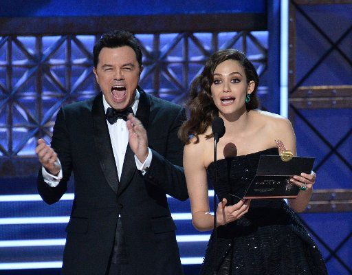 Actor\/producer Seth MacFarlane and actor Emmy Rossum presenting onstage during the 69th annual Primetime Emmy Awards at Microsoft Theater in Los Angeles on September 17, 2017. Photo by Jim Ruymen\/