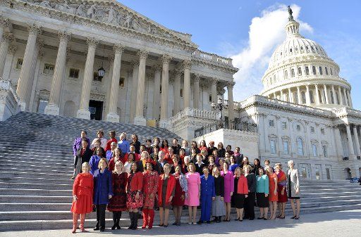 House Democratic Leader Nancy Pelosi (D-CA), (C, front row), joins a group of House Democratic women for a group photo on the steps of the U.S. Capitol, January 4, 2017, in Washington, D.C. There are now a historically-high 65 Democratic women in the 115th Congressional House. Photo by Mike Theiler\/