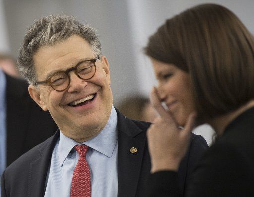 Sen. Al Franken, D-Minn., talks to a reporter before a series of Senate votes including the confirmation vote of EPA director Scott Pruitt, on Capitol Hill in Washington, D.C. on February 15, 2017. Photo by Kevin Dietsch\/