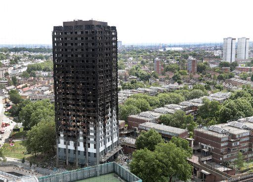 A view shows the total destruction of the 24-story Grenfell Tower building on June 16, 2017, which was destroyed by fire in North Kensington in West London on Wednesday morning June 14th. The death toll has risen to 30 and at least 18 people remain in critical condition. Photo by Hugo Philpott\/