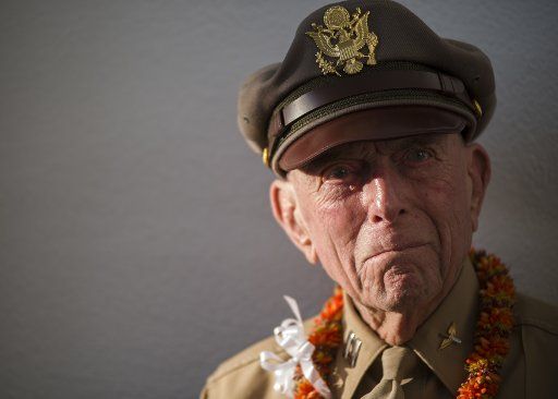 Jerry Yellin, former captain and WWII Army Air Corps P-51 pilot, attends the 6th annual Blackened Canteen ceremony at the USS Arizona Memorial during the 75th Commemoration of the attacks on Pearl Harbor on December 6, 2016. The blackened canteen is a relic of an air raid over Shizuoka, Japan in 1945, and is used for pouring bourbon whiskey as an offering to the fallen in the hallowed waters of Pearl Harbor. December 7, 2016, marks the 75th anniversary of the attacks on Pearl Harbor and Oahu. Since December 7, 1941, the U.S. and Japan have endured more than 70 years of continued peace, a cornerstone of security and prosperity in the Indo-Asia-Pacific region. As a Pacific nation, the U.S. is committed to continue its responsibility of protecting the Pacific sea-lanes, advancing international ideals and relationships, well as delivering security, influence and responsiveness in the region. Photo by Somers Steelman\/U.S. Navy\/