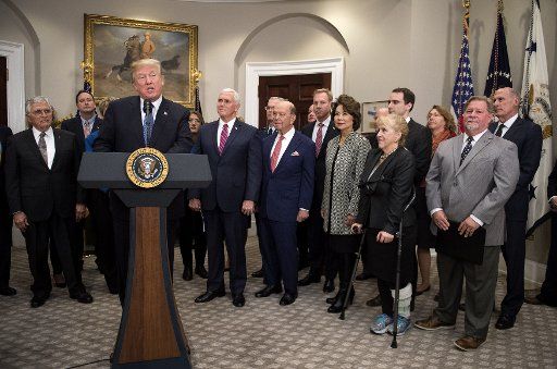 President Donald Trump delivers remarks before signing Space Policy Directive 1, in the Roosevelt Room at the White House on December 11, 2017 in Washington, D.C. Trump was joined by members of the Space Council, Cabinet officials, congressional members and industry leaders. The directive assigns the NASA to initiate a space to return American astronauts back to the Moon, and eventually to Mars. Photo by Kevin Dietsch\/