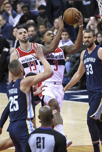 Washington Wizards guard Bradley Beal (3) scores in the first half against Memphis Grizzlies forward Chandler Parsons (25) at Capital One Arena in Washington, D.C. on December 13, 2017. Photo by Mark Goldman\/