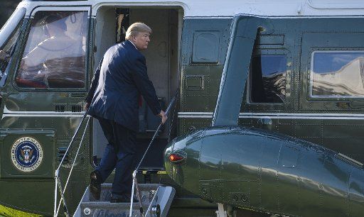 President Donald Trump boards Marine One as he departs on the South Lawn of the White House in Washington, DC on November 3, 2017. The president is visiting various countries in Asia including Japan, South Korea, China and the Philippines. ...