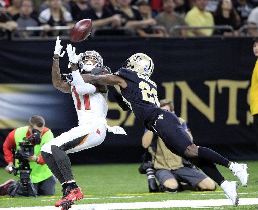 New Orleans Saints cornerback Ken Crawley (20) knocks the ball away from Tampa Bay Buccaneers wide receiver DeSean Jackson (11) at the Mercedes-Benz Superdome in New Orleans November 5, 2017. Photo by AJ Sisco\/