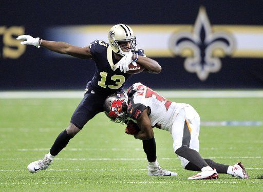 New Orleans Saints wide receiver Michael Thomas (13) is tackled by Tampa Bay Buccaneers defensive back Robert McClain (36) after a short gain at the Mercedes-Benz Superdome in New Orleans November 5, 2017. Photo by AJ Sisco\/