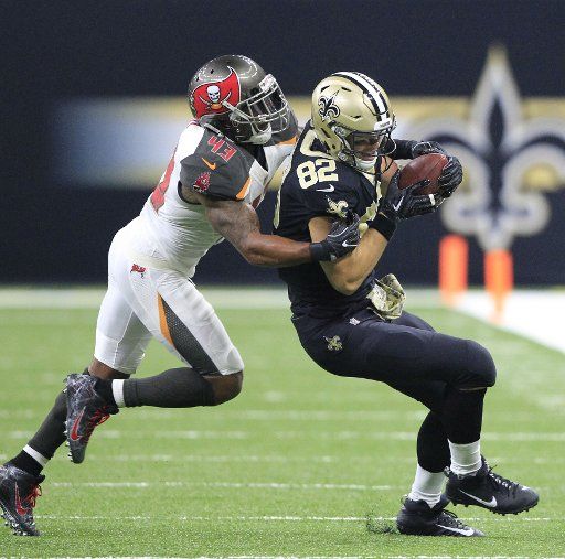Tampa Bay Buccaneers defensive back T.J. Ward (43) tackle New Orleans Saints tight end Coby Fleener (82) after a 13 yard gain at the Mercedes-Benz Superdome in New Orleans November 5, 2017. Photo by AJ Sisco\/