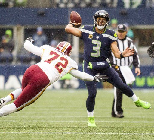Seattle Seahawks quarterback Russell Wilson (3) passes under pressure from Washington Redskins offensive tackle Kevin Bowen (72) during the second quarter in their game against the at CenturyLink Field in Seattle, Washington on November 5, 2017. ...