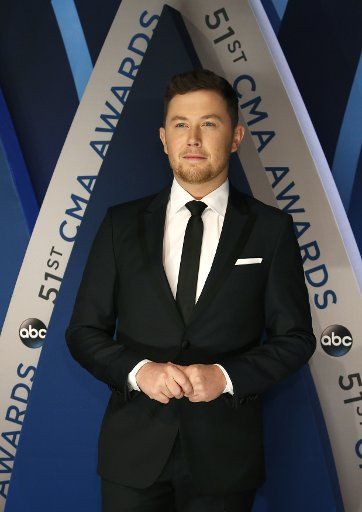 Scotty McCreery walks the red carpet as he arrives for the 51st Annual Country Music Association Awards on November 8, 2017 at the Bridgestone Arena in Nashville. Photo by John Sommers II\/