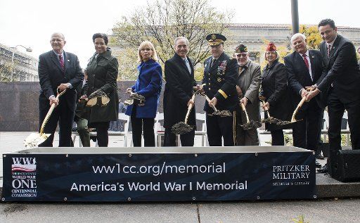 Dignitaries, including D.C. Mayor Murial Bowser (2nd-L), Veterans Affairs Secretary David Shulkin (center left), and Chief of Staff of the Army Gen. Mark A. Milley (center right), participate in the ceremonial ground breaking for the WWI Memorial in ...