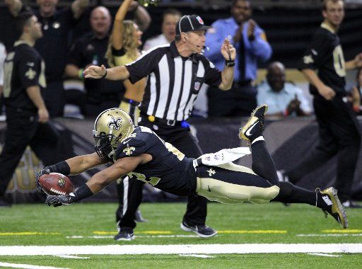 New Orleans Saints running back Mark Ingram (22) dives for the end zone after a 54 yard gain against the New York Jets at the Mercedes-Benz Superdome in New Orleans December 17, 2017. Ingram was ruled out of bounds at the 10 yard line on the play. Photo by AJ Sisco\/