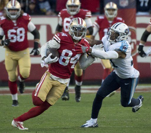 San Francisco 49ers WR Kendrick Bourne takes a Jimmy Garoppolo pass 54 yards in the fourth quarter against the Tennessee Titans at Levi\