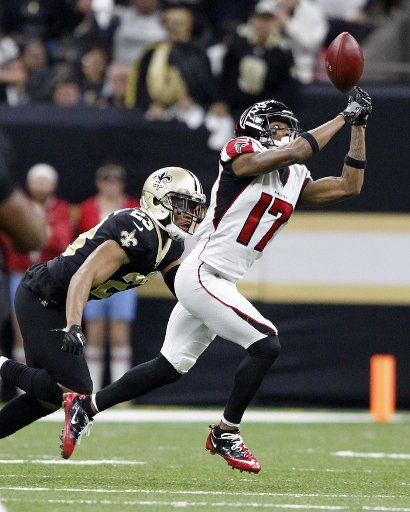 Atlanta Falcons wide receiver Marvin Hall (17) tips the ball into the air at the Mercedes-Benz Superdome in New Orleans December 24, 2017. New Orleans Saints rookie cornerback Marshon Lattimore (23) ended up with a interception on the play. Photo by AJ Sisco\/