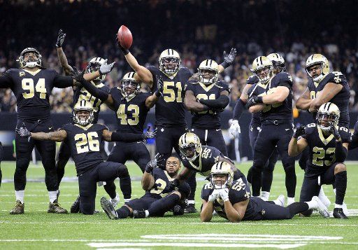 New Orleans Saints defense celebrates a interception agains the Atlanta Falcons at the Mercedes-Benz Superdome in New Orleans December 24, 2017. Photo by AJ Sisco\/