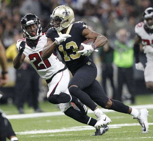 New Orleans Saints wide receiver Michael Thomas (13) out runs Atlanta Falcons cornerback Desmond Trufant (21) for a 27 yard gain in the third quarter at the Mercedes-Benz Superdome in New Orleans December 24, 2017. Photo by AJ Sisco\/