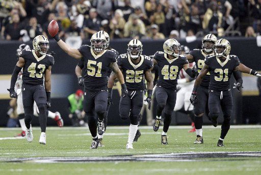 New Orleans Saints defense celebrates a interception of a Atlanta Falcons pass at the Mercedes-Benz Superdome in New Orleans December 24, 2017. Photo by AJ Sisco\/