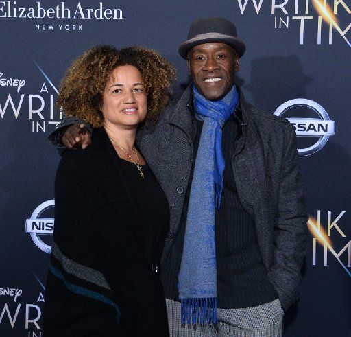 Actor Don Cheadle and his partner, actress Bridgid Coulter attend the premiere of the sc-fi motion picture fantasy ""A Wrinkle in Time" at the El Capitan Theatre in the Hollywood section of Los Angeles on February 26, 2018. Storyline: After the disappearance of her scientist father, three peculiar beings send Meg, her brother, and her friend to space in order to find him. Photo by Jim Ruymen\/