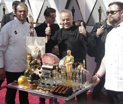 Chef Wolfgang Puck gives a thumbs up as he arrives on the red carpet for the 90th annual Academy Awards at the Dolby Theatre in the Hollywood section of Los Angeles on March 4, 2018. Photo by John Angelillo\/