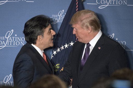 Hector Barreto, chairman of the Latino Coalition and former United States Small Business Administrator, left, welcomes United States President Donald J. Trump prior to remarks at the Latino Coalition Legislative Summit at the JW Marriott Hotel in Washington, DC on Wednesday, March 7, 2018. Photo by Ron Sachs\/