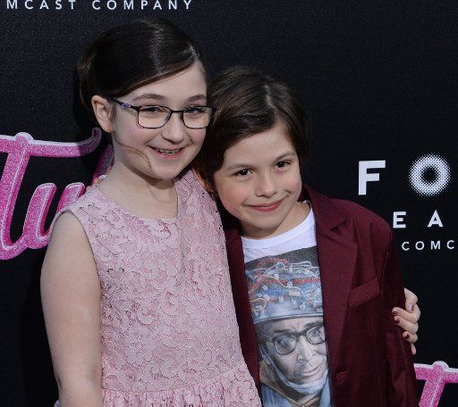 Cast members Lia Frankland (L) and Asher Miles Fallica attend the premiere of the motion picture dramatic comedy "Tully" at Regal Cinemas LA Live in downtown Los Angeles on April 18, 2018. Storyline: Marlo, a mother of three including a newborn, who is gifted a night nanny by her brother. Hesitant to the extravagance at first, Marlo comes to form a unique bond with the thoughtful, surprising, and sometimes challenging young nanny named Tully. Photo by Jim Ruymen\/