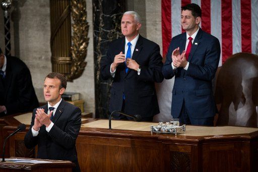 French President Emmanuel Macron, Vice President Mike Pence and Speaker of the House Paul Ryan (R-WI) clap during Macron\