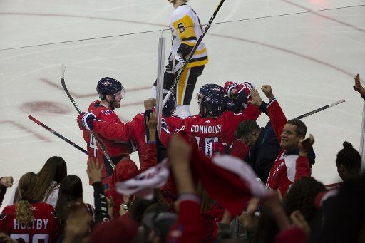 Capitals right wing Brett Connolly (10) celebrates with teammates during the second round NHL playoff game between the Pittsburgh Penguins and Washington Capitals at Capital One Arena in Washington, D.C. on April 29, 2018. Photo by Alex Edelman\/