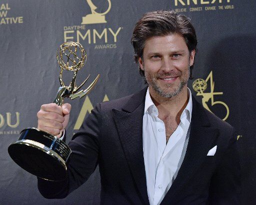 Greg Vaughan holds up his award for Outstanding Supporting Actor in a Drama Series backstage in the press room during the 45th Annual Daytime Emmy Awards at the Pasadena Civic Auditorium in Pasadena, California on April 29, 2018. Photo by Chris Chew\/