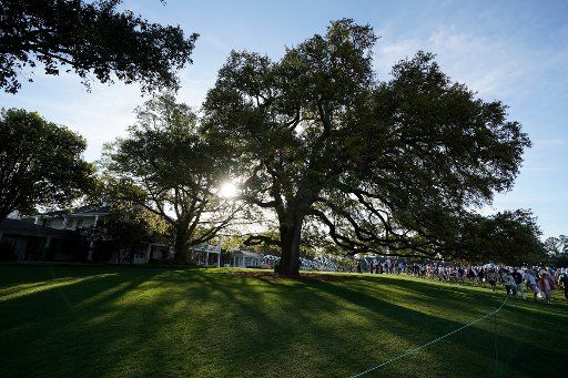 The sun rises over the oak near the clubhouse during a practice round before the start of the Masters at Augusta National Golf Club, on April 2, 2018 in Augusta, Georgia. Photo by Kevin Dietsch\/