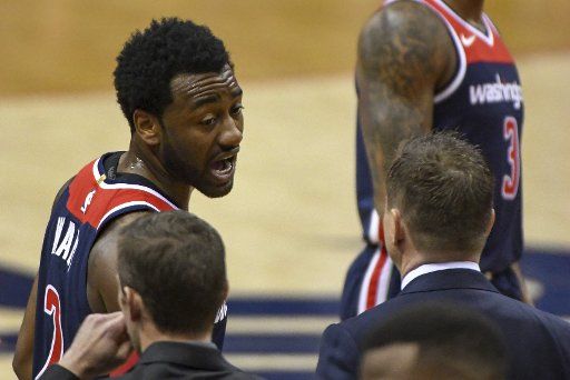 Washington Wizards guard John Wall (2) talks with Washington Wizards head coach Scott Brooks (R) in the first half at Capital One Arena in Washington, D.C. on April 10, 2018. Photo by Mark Goldman\/