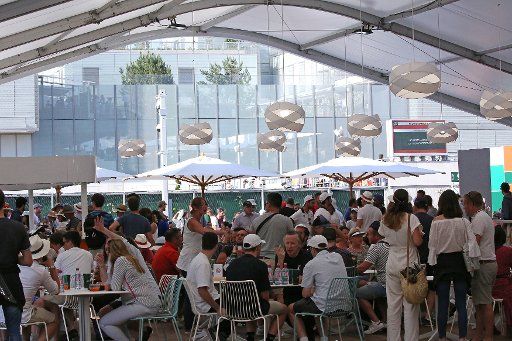 Fans relax at a new dining facility at Roland Garros in Paris on June 2, 2018. Photo by David Silpa\/