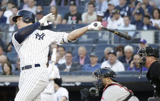 New York Yankees Aaron Judge hits an RBI single in the first inning against the Boston Red Sox at Yankee Stadium in New York City on May 9, 2018. Photo by John Angelillo\/