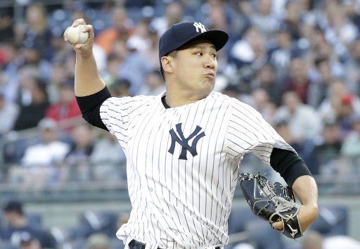 New York Yankees starting pitcher Masahiro Tanaka throws a pitch in the first inning against the Boston Red Sox at Yankee Stadium in New York City on May 9, 2018. Photo by John Angelillo\/