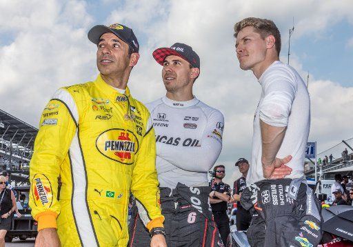 Drivers Helio Castroneves (left to right), Robert Wickens, and Josef Newgarden watch qualiying action at the Indianapolis Motor Speedway on May 19 2018 in Indianapolis, Indiana. Photo by Edwin Locke\/